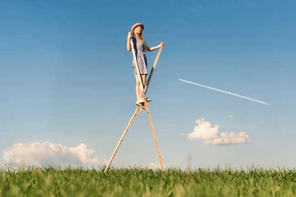Girl walking on stilts