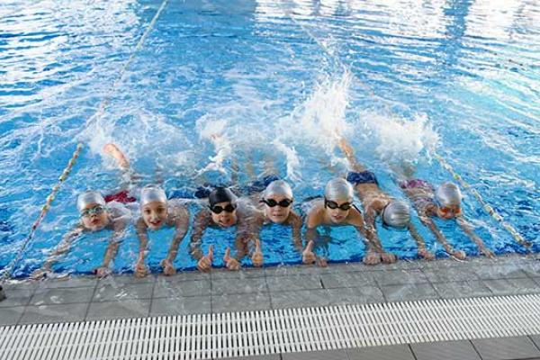 Children learning to swim