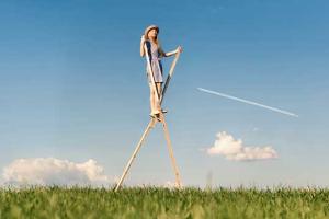 Girl walking on stilts